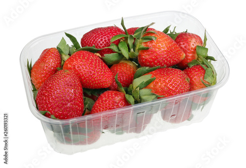 Big strawberry berries in an industrial plastic box isolated macro