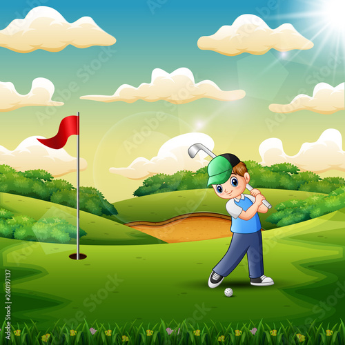 Joyful a boy playing golf in the court