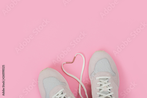 Fashion Trendy Trainers with Heart. Love, Hipster Set. Female sneakers, sport shoes in flat lay style, top view.
