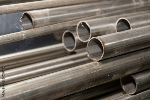 Metal stainless steel pipe on a pile.