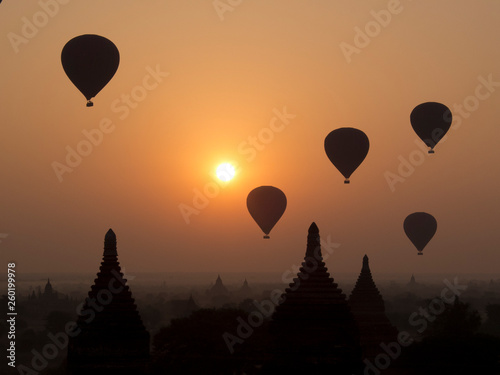 Many balloons in the sky over Bagan temples at the sunrise - Myanmar.