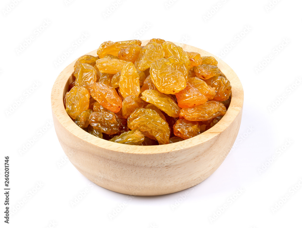 Yellow golden raisins in wood bowl isolated on white background. full depth of field Yellow golden raisins in wood bowl isolated on white background. full depth of field