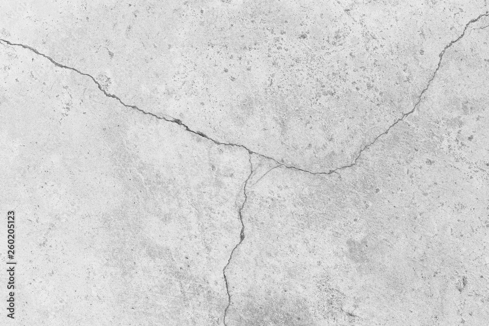Fototapeta premium White Cracked concrete wall surface of rough texture background.