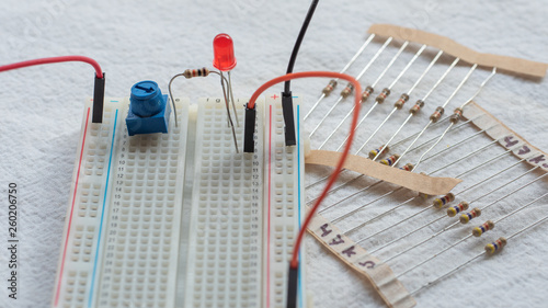 Принти на полотні Potentiometer, resistors and red LED set up on a breadboard