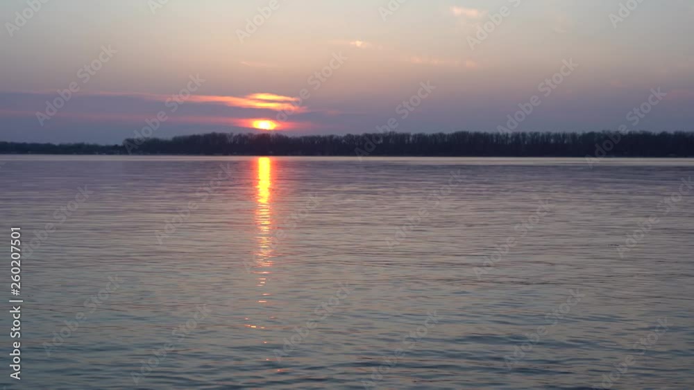 Beautiful sunset on the big river, the sun path burns with gold Beautiful sunset on the big river, the sun path burns with gold