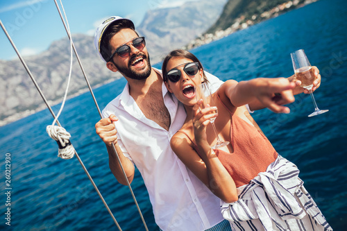 Loving couple spending happy time on a yacht at sea. Luxury vacation on a seaboat. © Mediteraneo