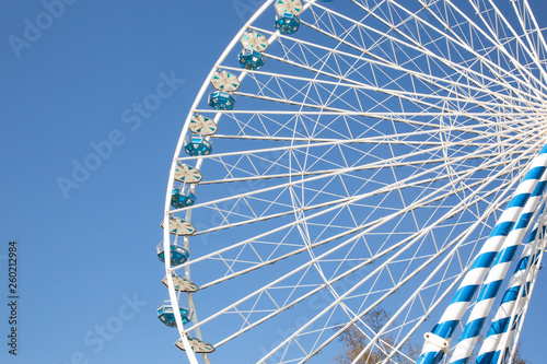 funfairs ferris wheel amusement park with blue sky