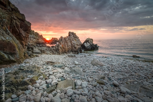 Boulder beach with dragon style rocks sunset Kullaberg nature reserve photo