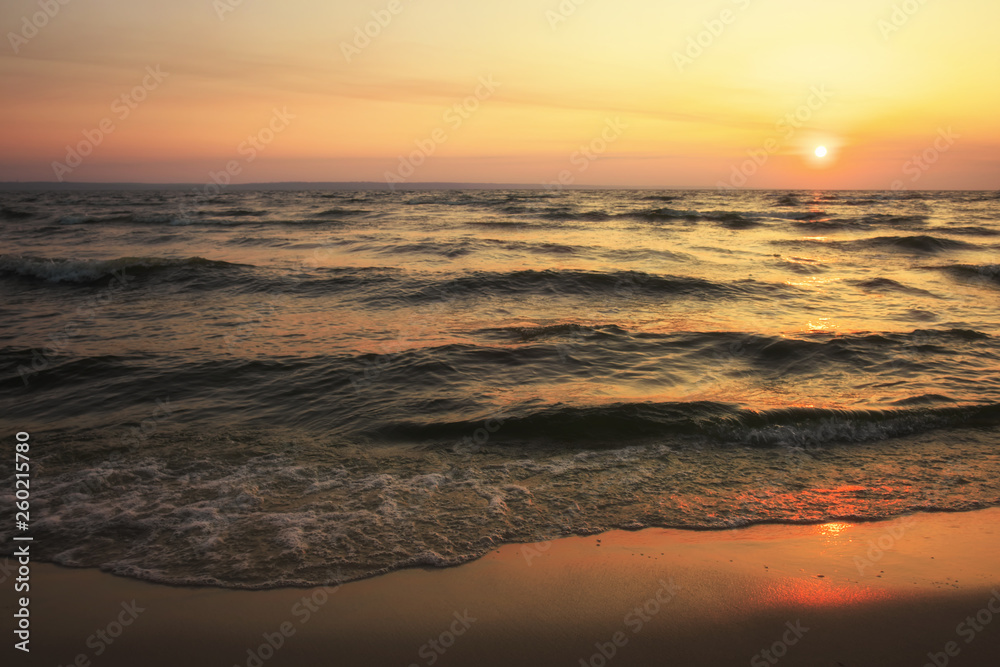 Obraz premium Colorful ocean beach sunrise. Dawn over the sea. Nature composition