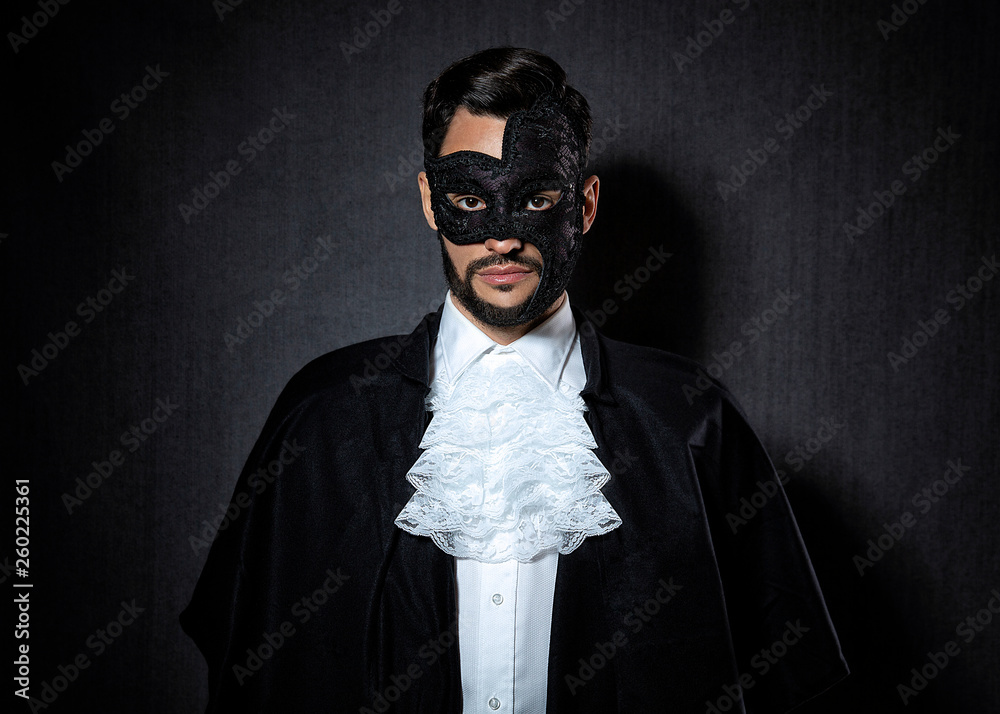 Young man wearing a dark mask, dressed in a Phantom of the Opera look Stock  Photo | Adobe Stock