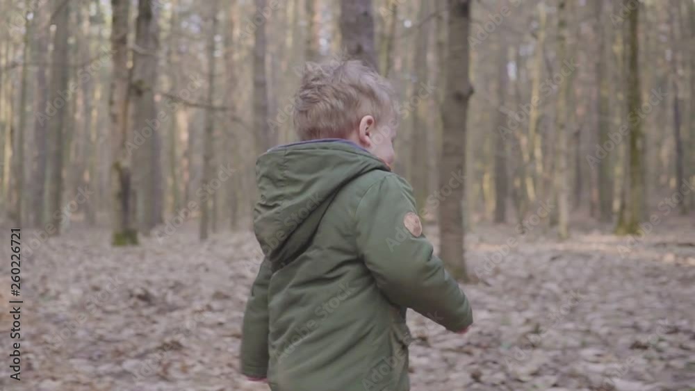 Small boy running in the forest, laughing and playing hd Small boy running in the forest, laughing and playing hd