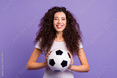 Portrait of her she nice cute charming lovely sweet adorable winsome attractive cheerful wavy-haired lady holding in hands ball isolated on bright vivid shine violet background © deagreez
