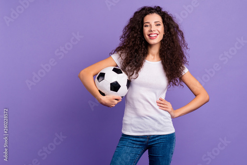 Portrait of her she nice cute charming lovely winsome attractive cheerful cheery wavy-haired lady holding in hands ball enjoying isolated on bright vivid shine violet background © deagreez