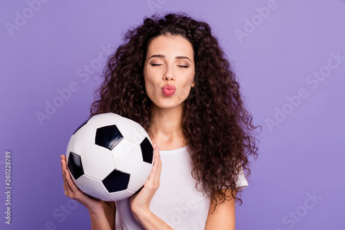Close-up portrait of her she nice cute charming lovely winsome lovable attractive cheerful cheery wavy-haired lady holding in hands ball isolated on bright vivid shine violet background © deagreez