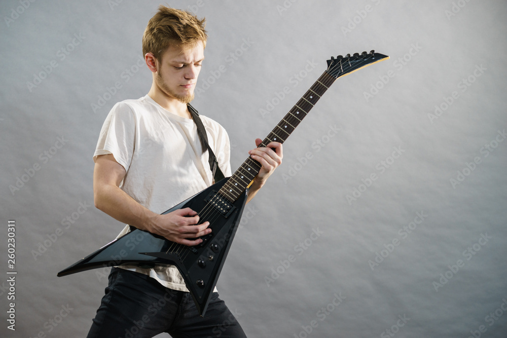Fototapeta premium Man playing on electric guitar