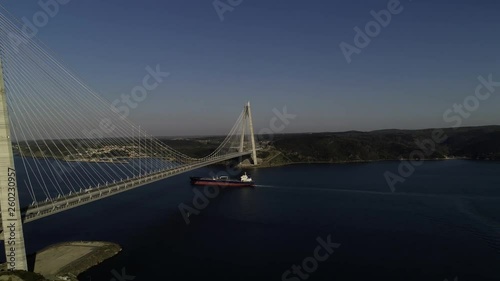 Aerial view of huge container ship and Yavuz Sultan Selim Bridge in the Bosphorus Istanbul Turkey