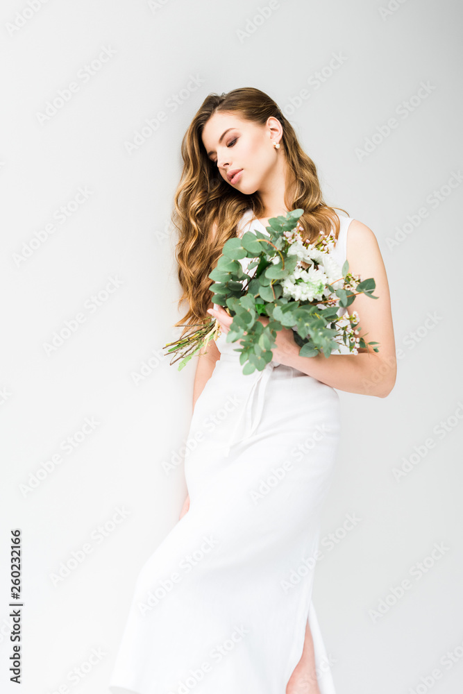 elegant girl in dress holding bouquet of flowers on white elegant girl in dress holding bouquet of flowers on white