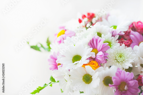 Fototapeta Naklejka Na Ścianę i Meble -  Beautiful bouquet of flowers on the white background. Chrysanthemum and wild roses. Space for a text. Close up.