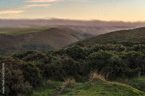 Evening dust over the landscape in the Exmoor National Park on Porlock Hill  Somerset  England  UK