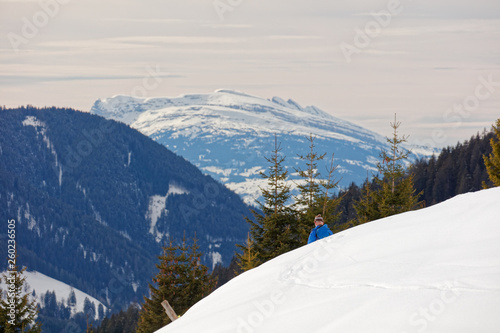 Ski tourist passing by with views from Furkajoch alpine road towards Switzerland