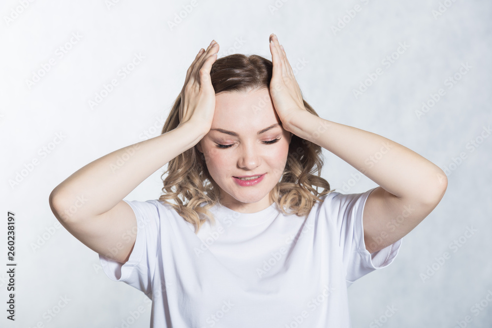 Young woman experiencing head hurts, looking miserable and exhausted. Young woman experiencing head hurts, looking miserable and exhausted.