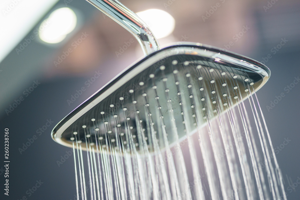 Water pours from the modern shower. Jets of water in the shower close-up. Water pours from the modern shower. Jets of water in the shower close-up.