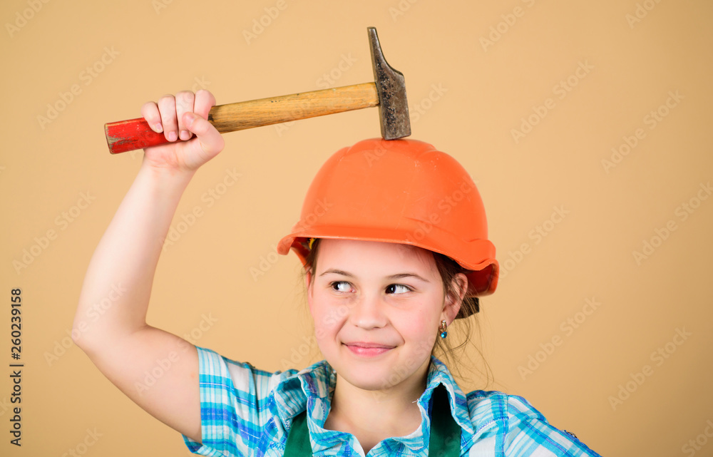 Little girl in helmet with hammer. Kid worker in hard hat. small girl repairing in workshop. Safety expert. Future profession. Labor day. 1 may. Foreman inspector. Repair. Master of repair Little girl in helmet with hammer. Kid worker in hard hat. small girl repairing in workshop. Safety expert. Future profession. Labor day. 1 may. Foreman inspector. Repair. Master of repair