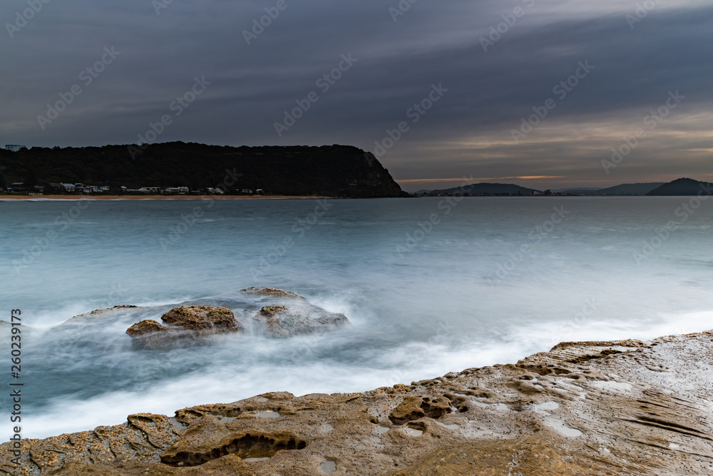 Soft High Cloud Sunrise Seascape from Rock Platform