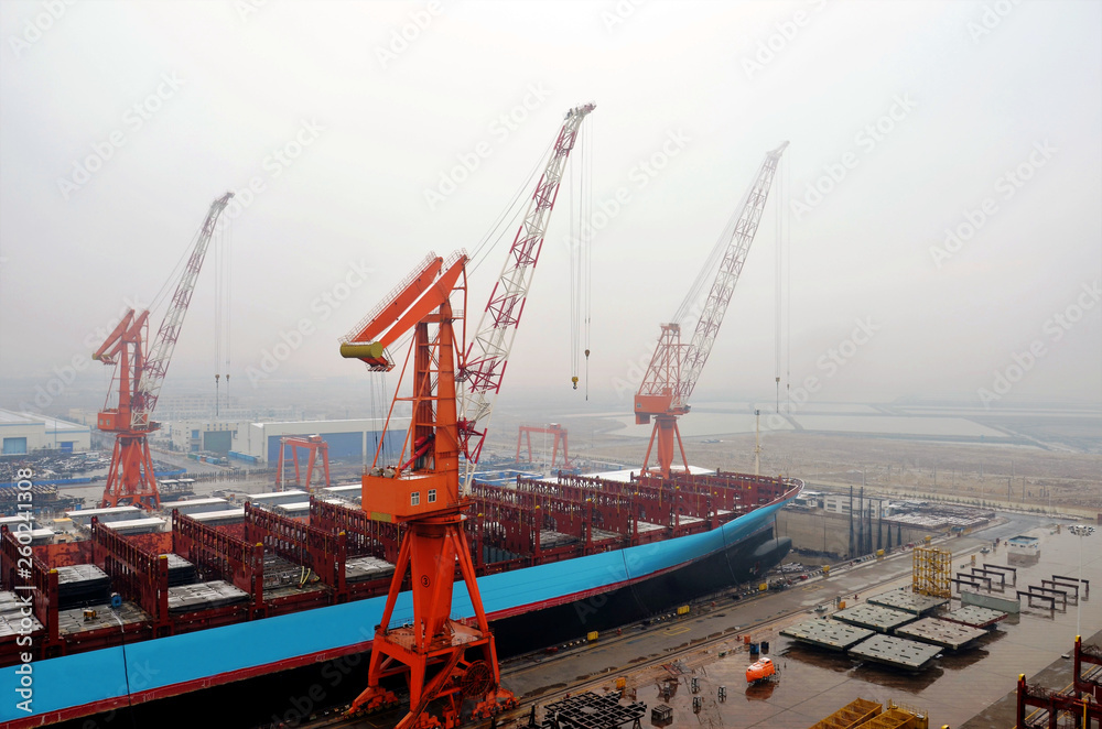 Ship inside dry dock. Panorama of the shipyard in Dalian, China.
