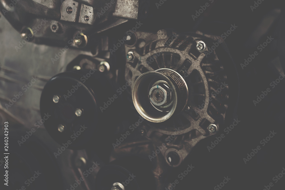 Disassembled car dirty engine and dynamo at garage Disassembled car dirty engine and dynamo at garage