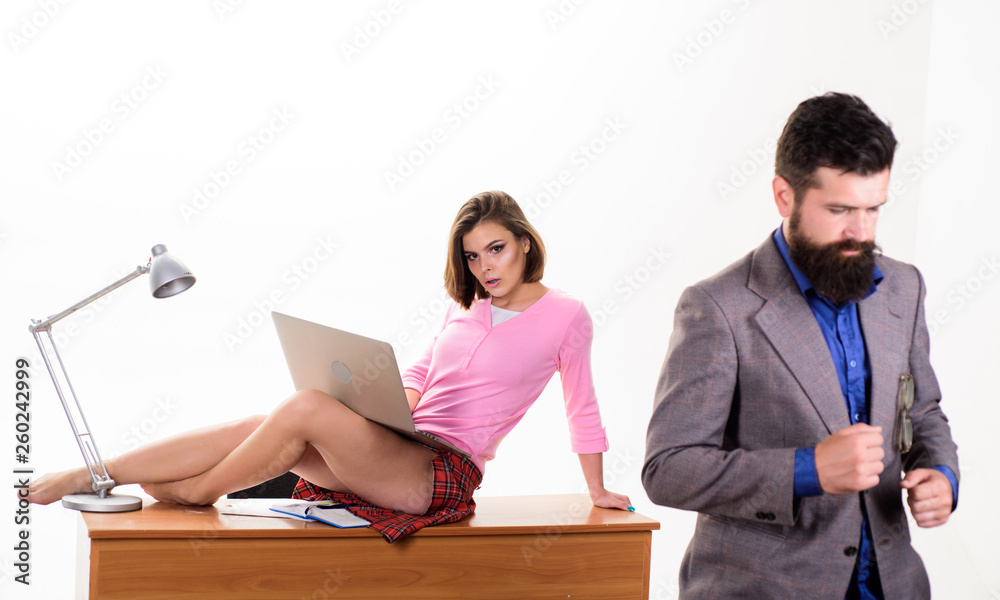 Modern working life. Sexy secretary using modern technologies for work.  Sensual woman and bearded man working in modern office. Pretty modern woman  surfing in internet Stock Photo | Adobe Stock