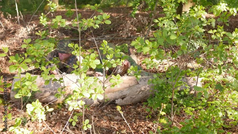 World War 2 – Two SS Soldiers observing in a forest World War 2 – Two SS Soldiers observing in a forest