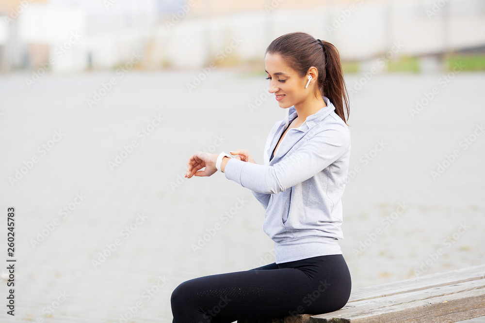 Fitness Girl. Portrait of a lovely young fitness girl listening music Fitness Girl. Portrait of a lovely young fitness girl listening music