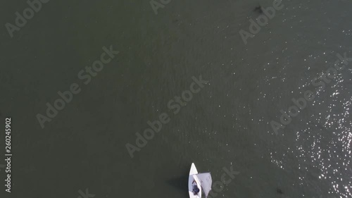 Sailboats floating on blue water of the lake. Competition sport of sailing.Yacht and beautiful seascapes photo