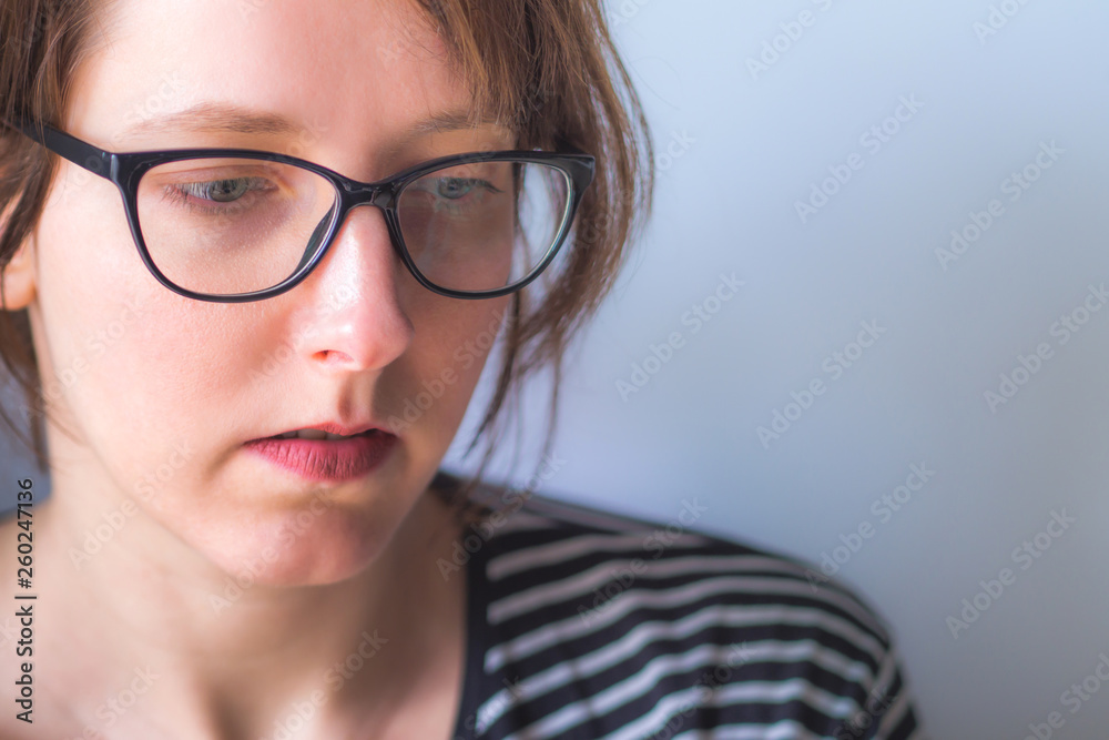 Fototapeta premium Young woman wearing glasses with copy space