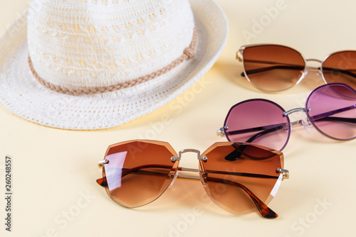 Summer accessories and fashion, Set of sunglasses and straw hats, Different type of style comparison.