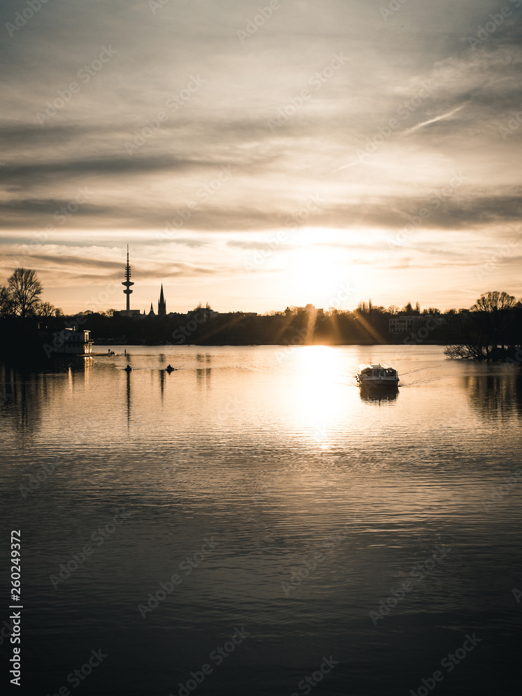 Sunset at the Alster with boat