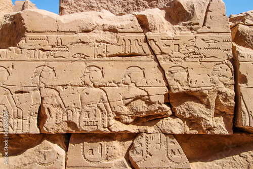Old Egypt hieroglyphs carved on the stone wall in The Karnak Temple Complex  Luxor  Egypt  ancient Thebes .