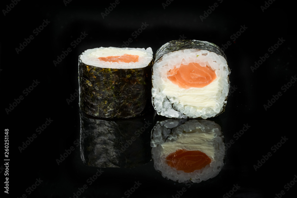 traditional fresh japanese sushi rolls on a black background traditional fresh japanese sushi rolls on a black background