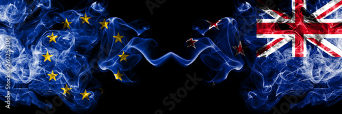 European Union vs New Zealand, New Zealander smoke flags placed side by side. Thick colored silky smoke flags of EU and New Zealand, New Zealander photo