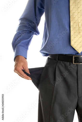 Business man showing his empty pockets demonstrating he has no money, Broke (Empty pockets)
