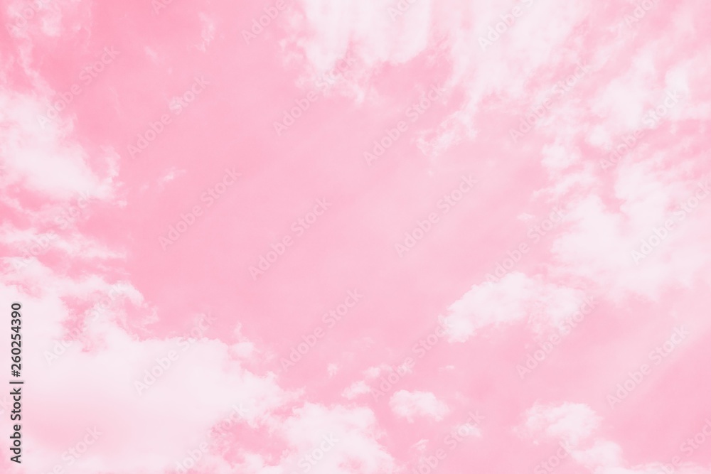 Light delicate pink sky background. Beautiful romantic sky with white clouds.Copy space, toned photo