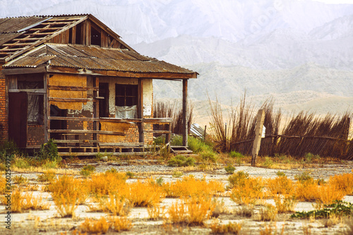 Abandoned house in the savanna. Abandoned. Lonely. Dry plants photo