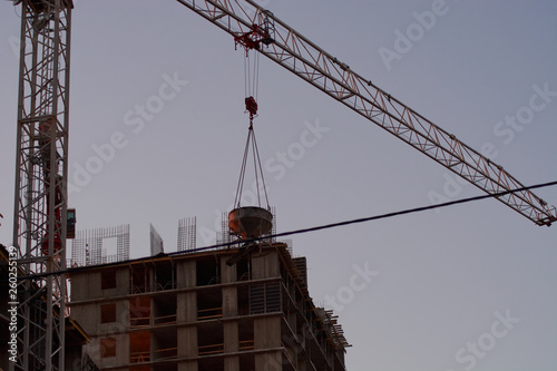 construction of the building cranes in the strongest light, otherwise