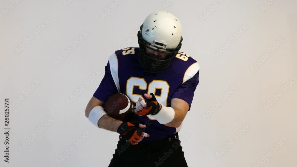 American Football Player wearing his sport dress on Black Background American Football Player wearing his sport dress on Black Background