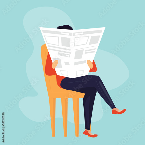 woman is reading newspaper on the sofa