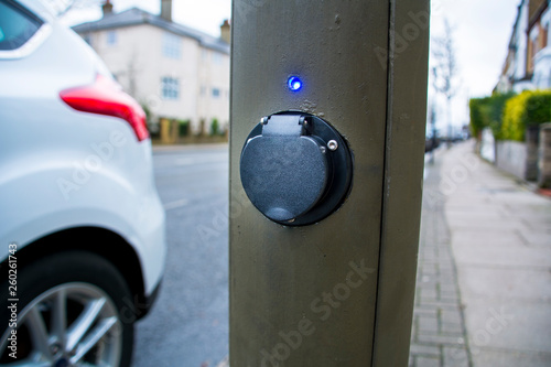 An on-street electric car charging point in a street lamp