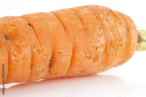 Closeup of one half of fresh orange carrot isolated on white background