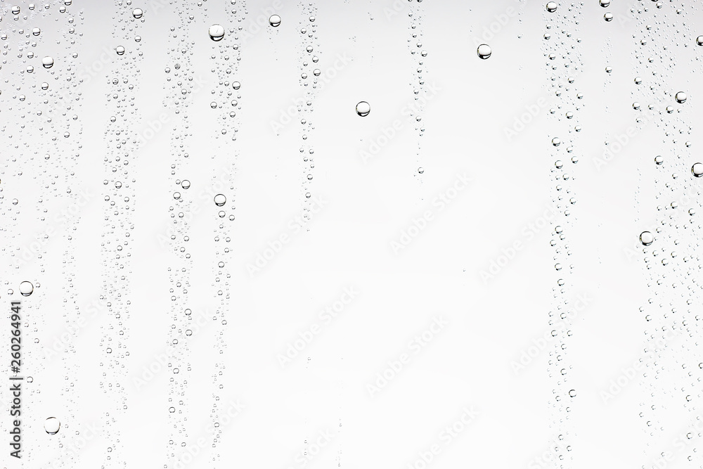 Obraz premium white isolated background water drops on the glass / wet window glass with splashes and drops of water and lime, texture autumn background