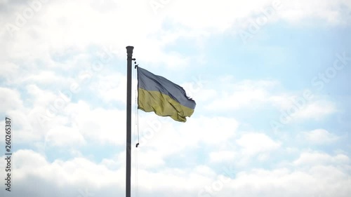 Flag of Ukraine. against blue sky, flag installed on flagpole in Kyiv